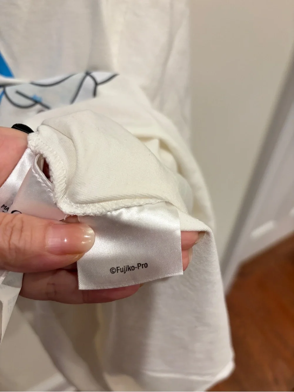 Gucci White Tee with Blue Logo and Doraemon Graphic